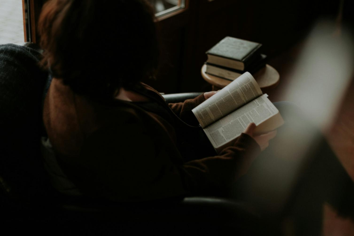 Individual studying investment concepts and financial strategies